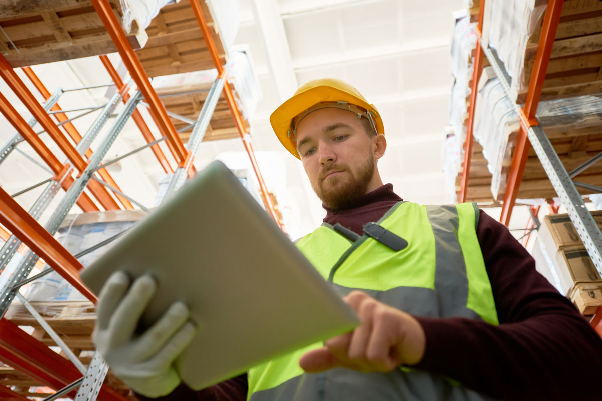 Warehouse worker using tablet on WiFi network