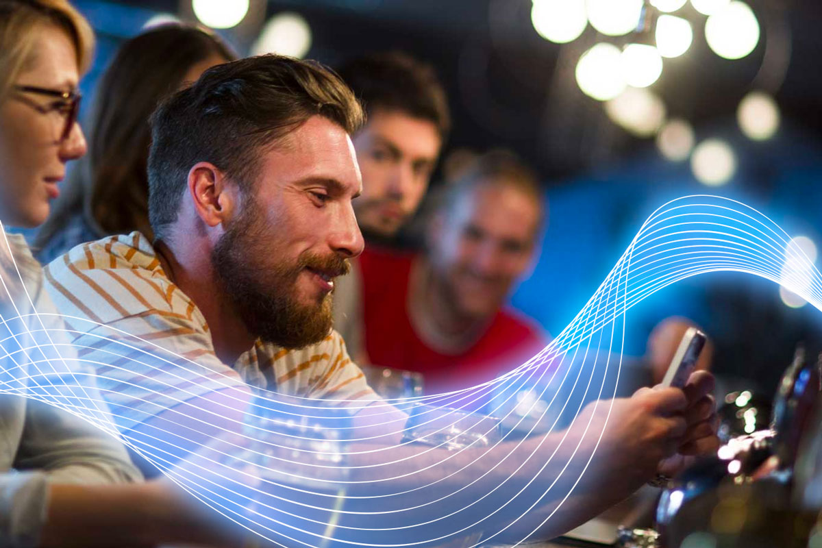 Man using WiFi Network in Bar