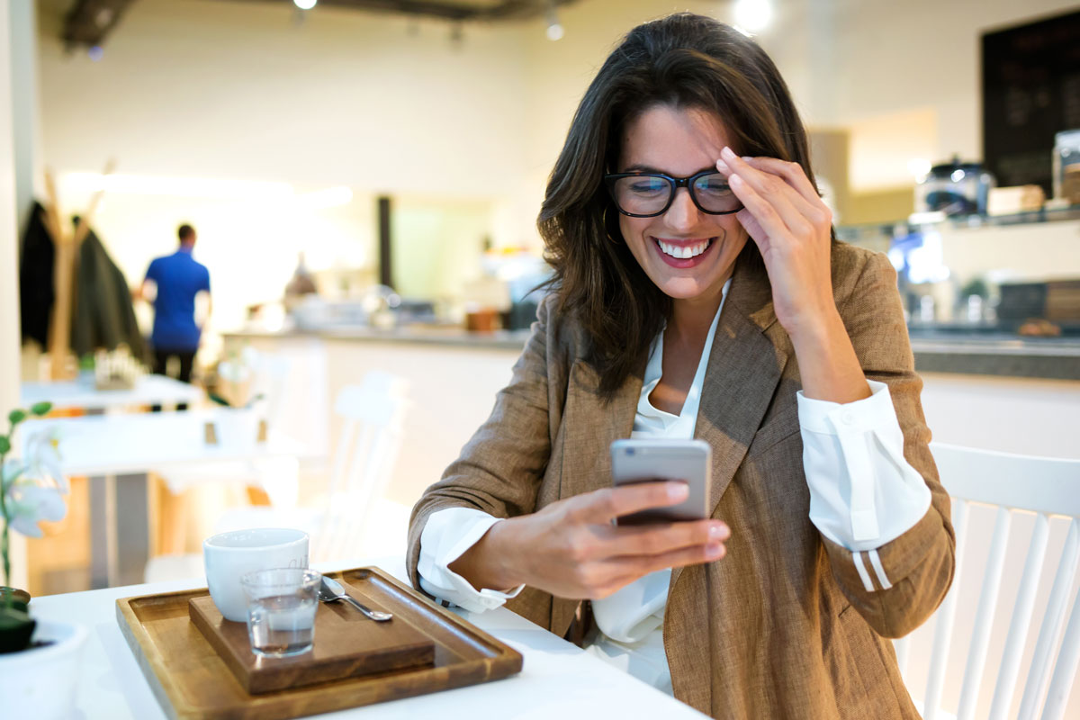 Woman using cafe free wifi