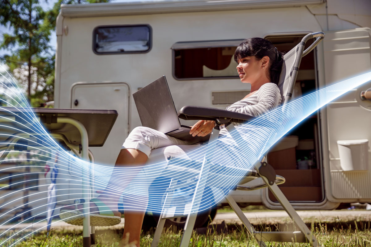 Woman using WiFi Network at Campsite