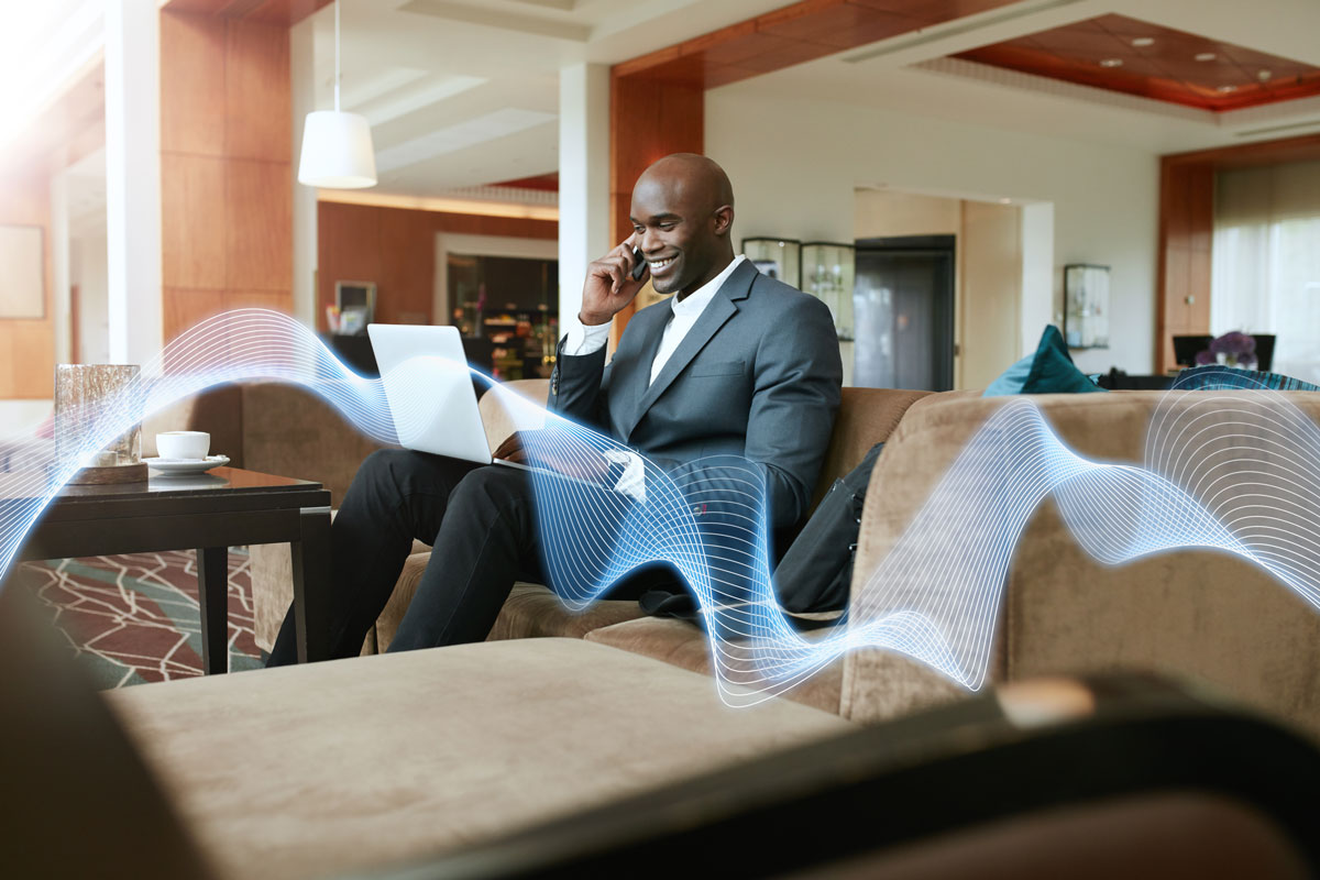 Businessman Using Hotel WiFi Network