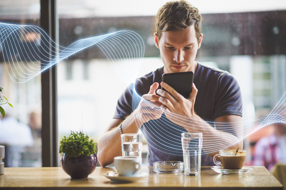 Man in Cafe using free Wifi