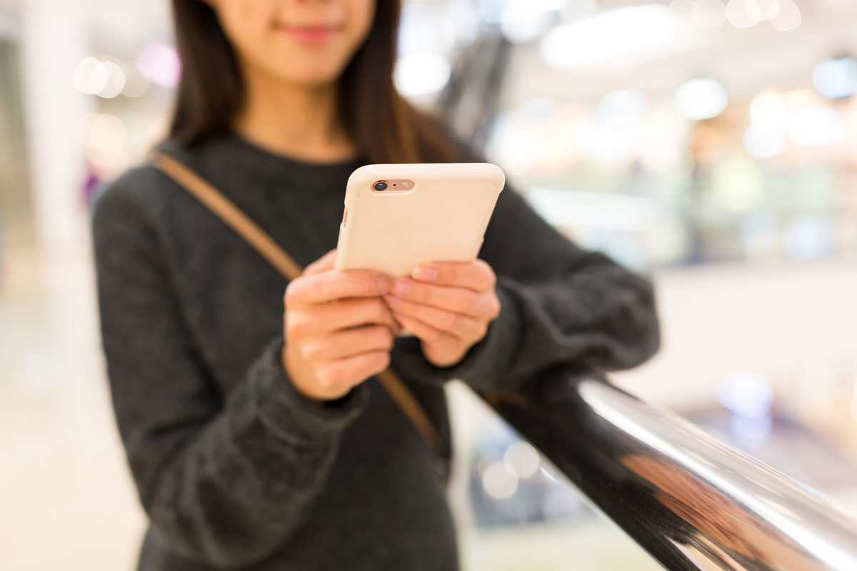 Customer using wifi in shopping centre